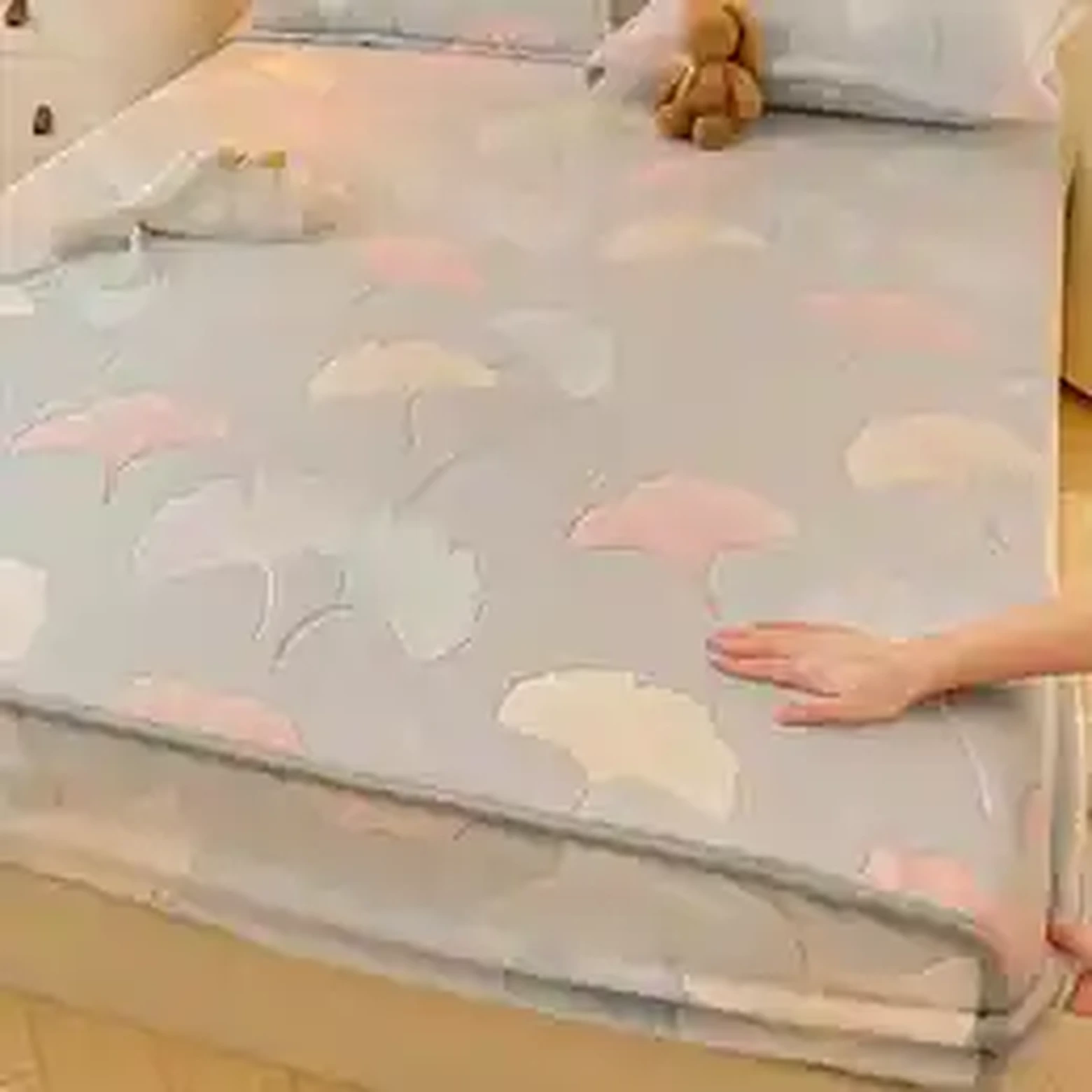 Pastel printed plush bedding on bed