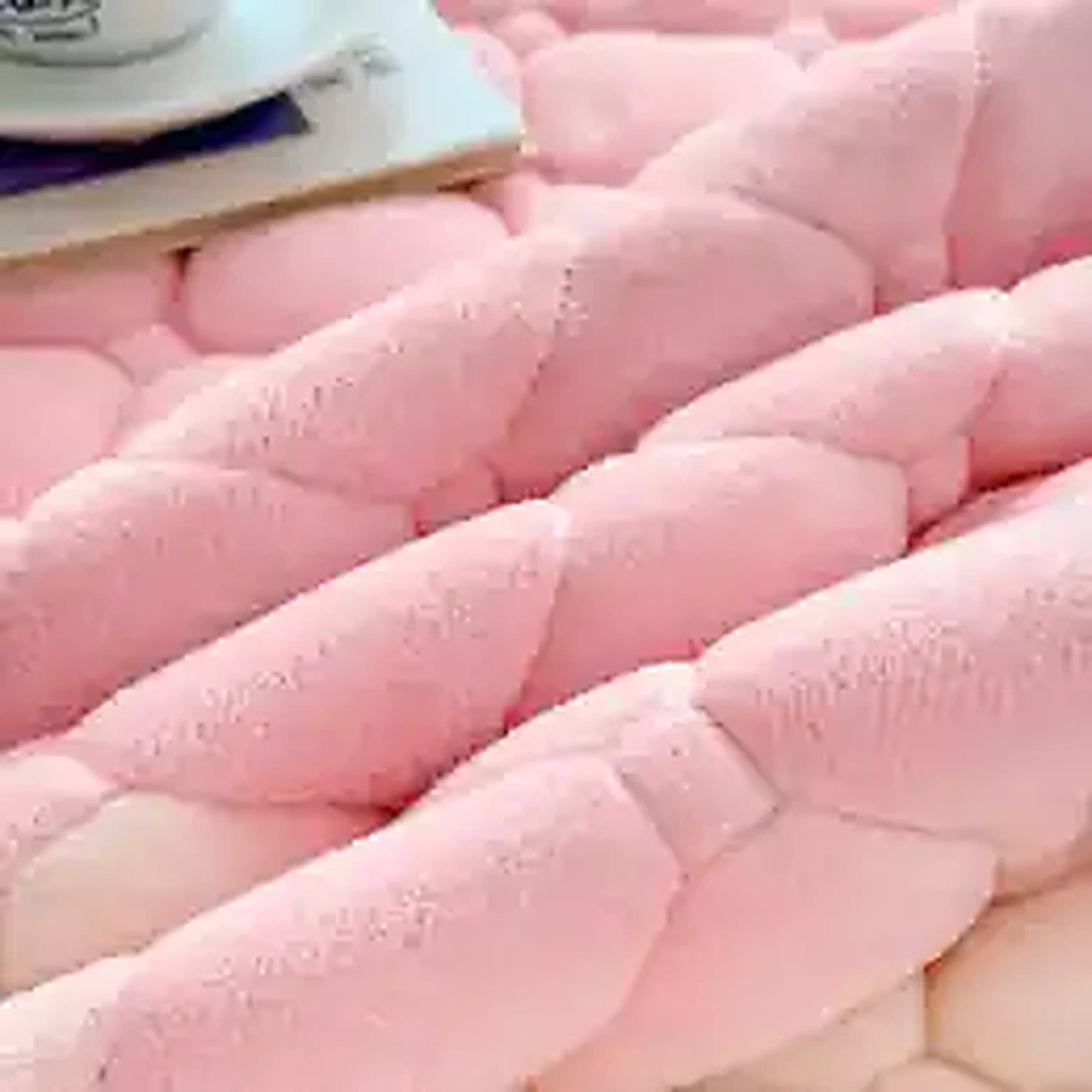 Close-up of soft fluffy fleece mattress pad texture