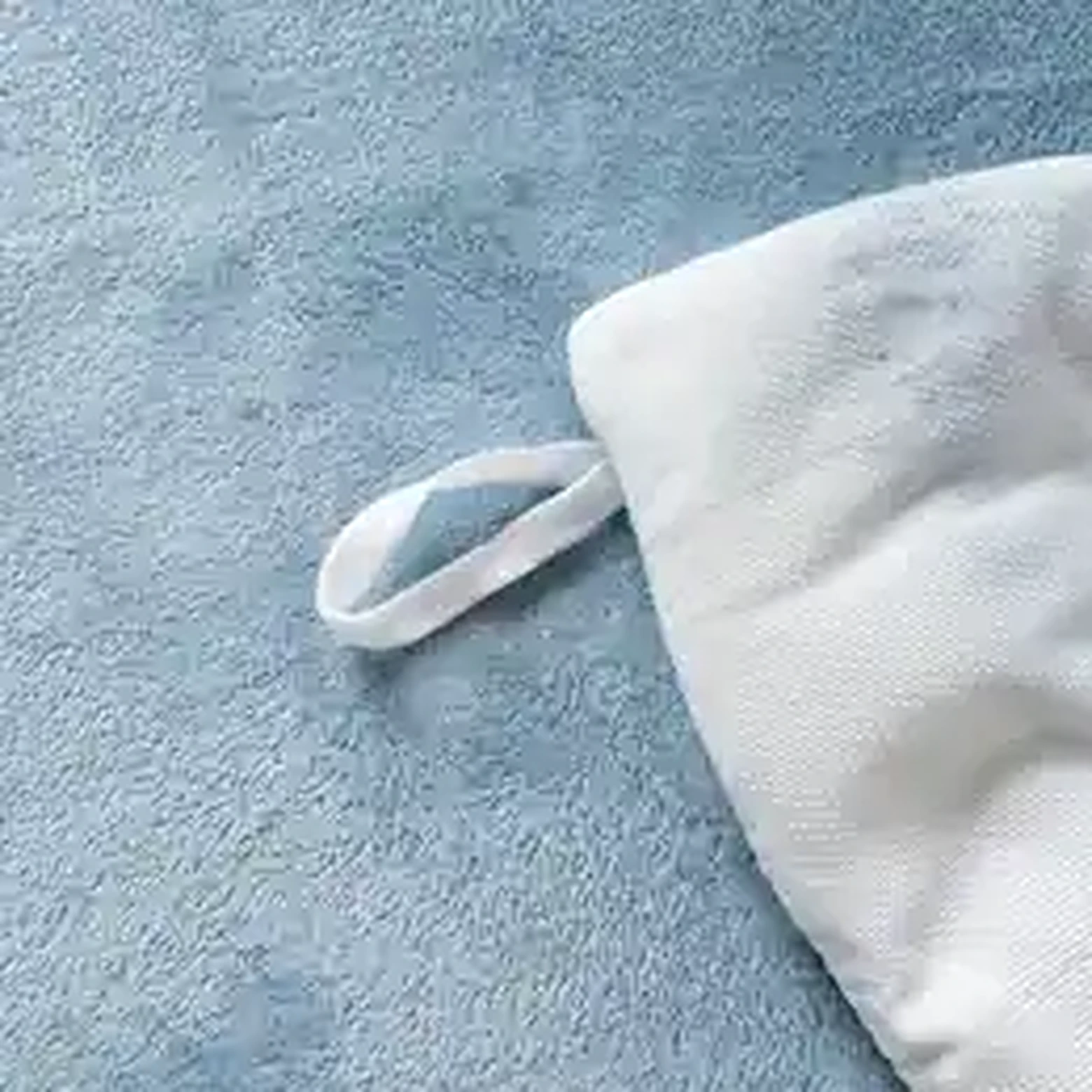 Soft blue fleece bedding detail
