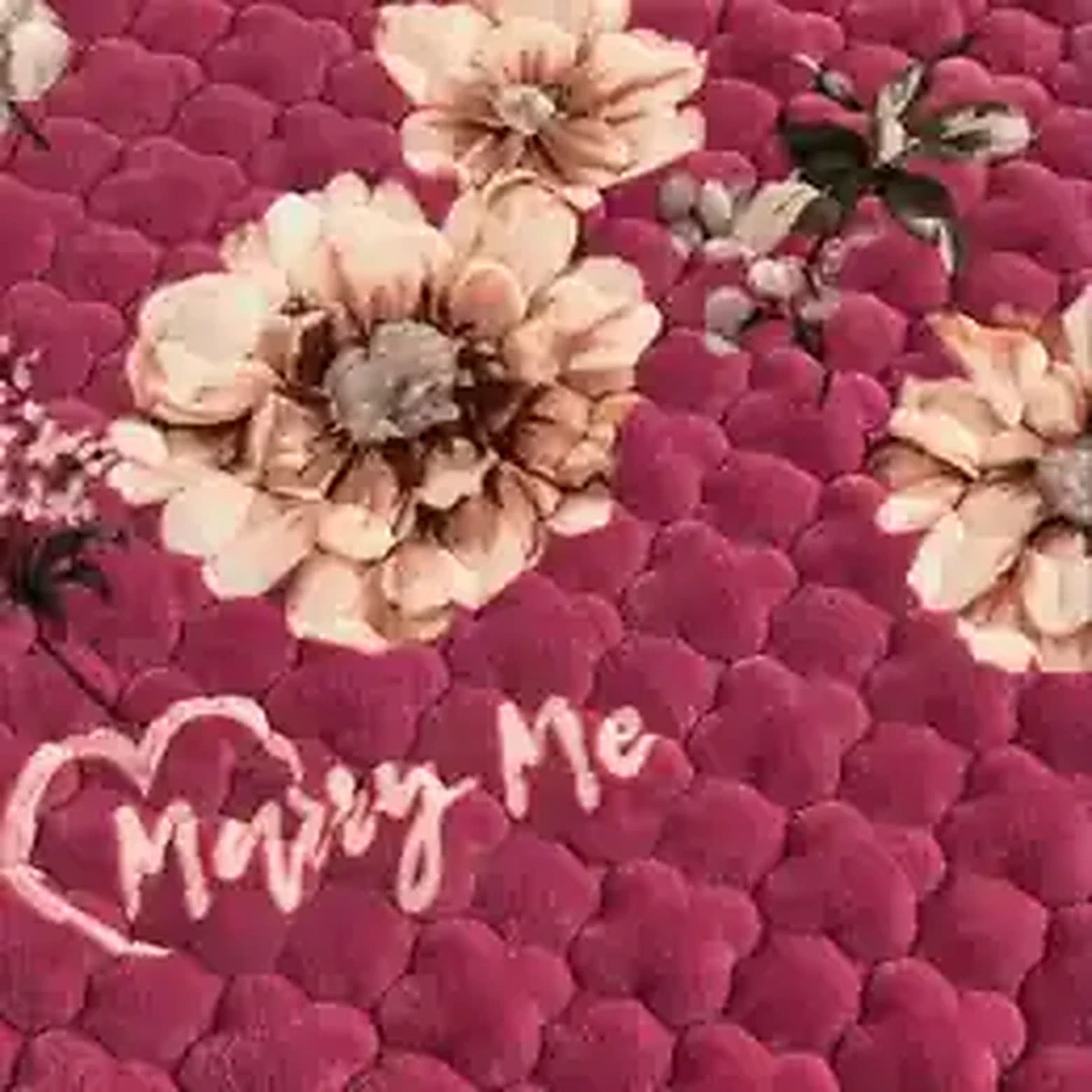 Close-up of pink quilted plush mattress protector texture
