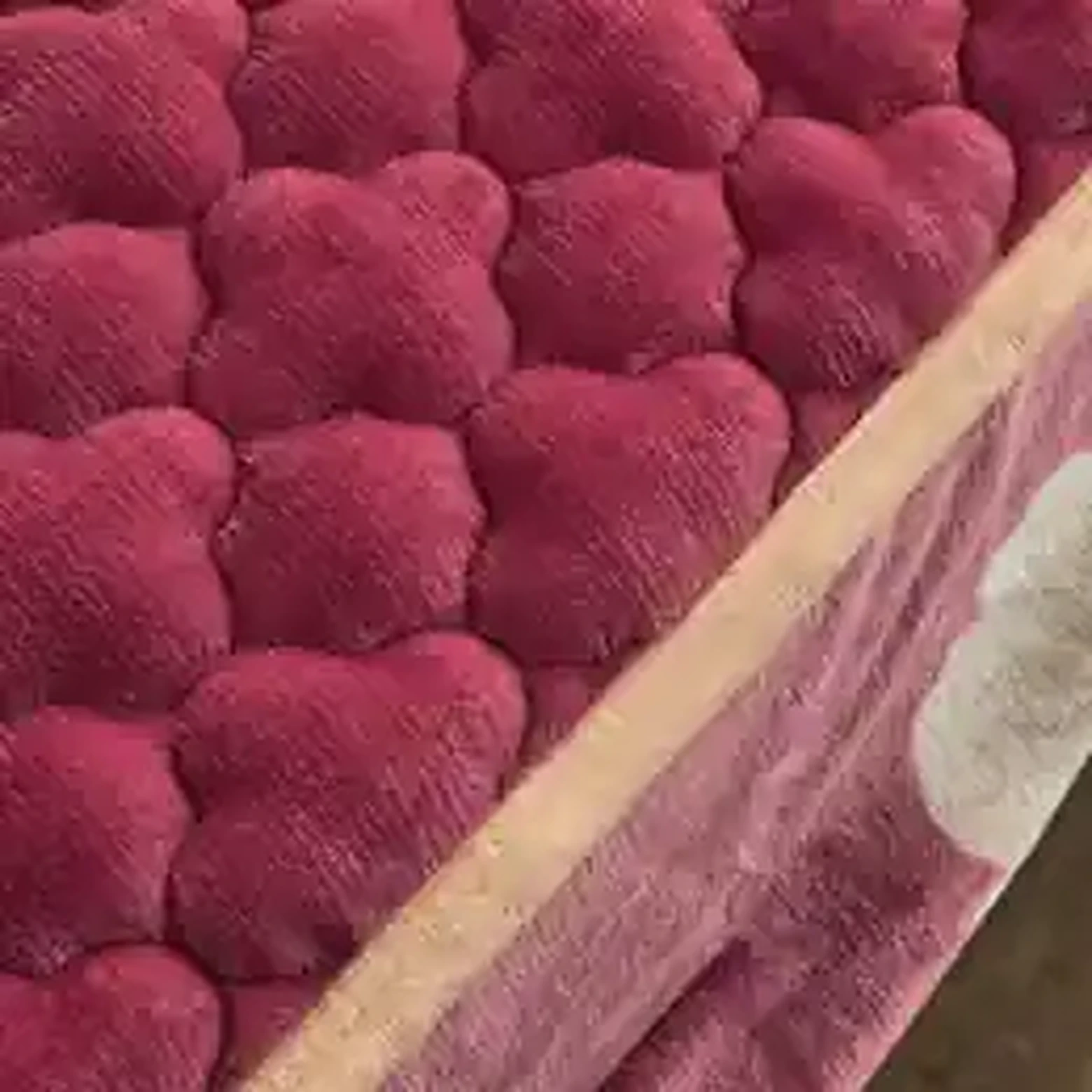Pink quilted mattress protector corner and edging