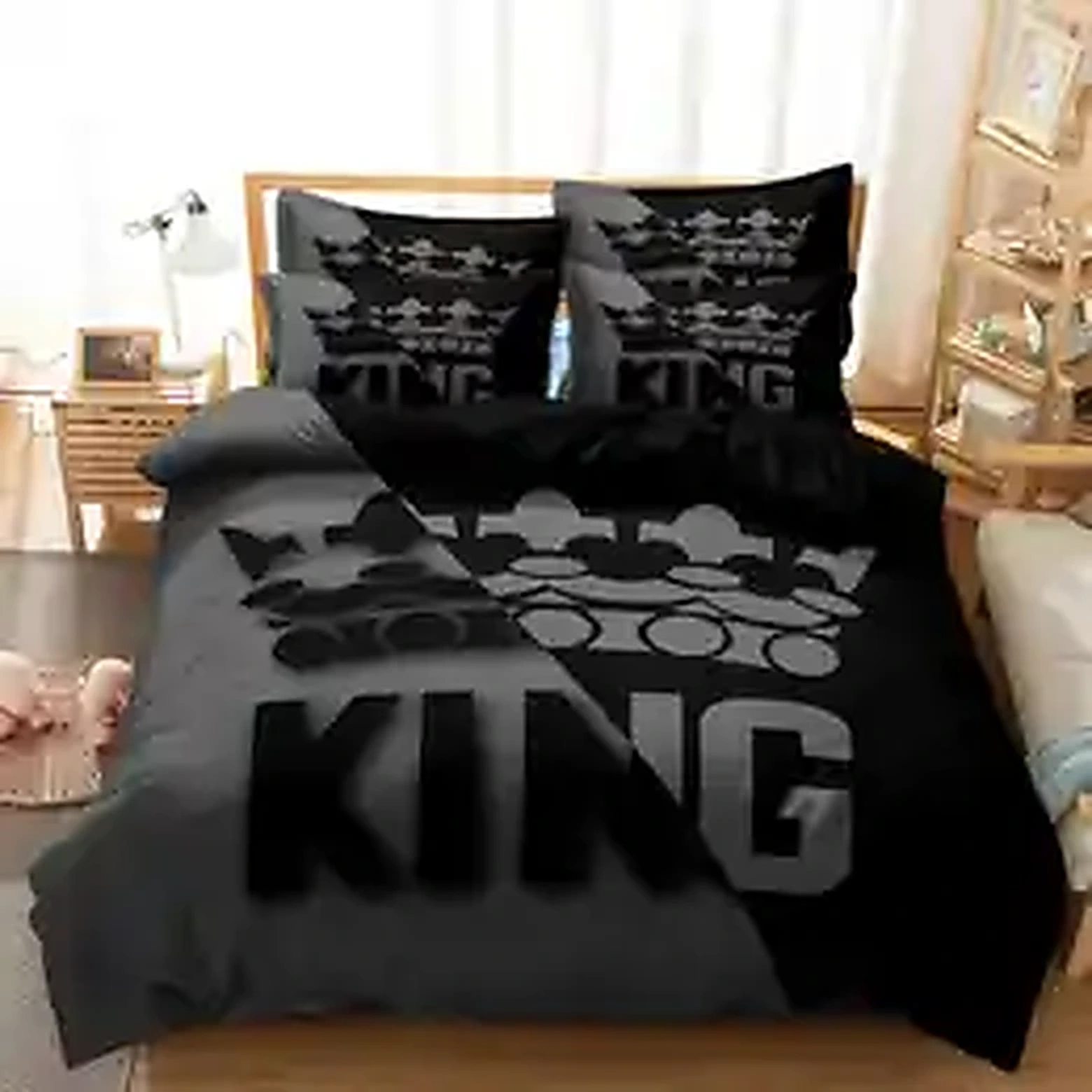 Black and gray duvet cover set on a wooden bed