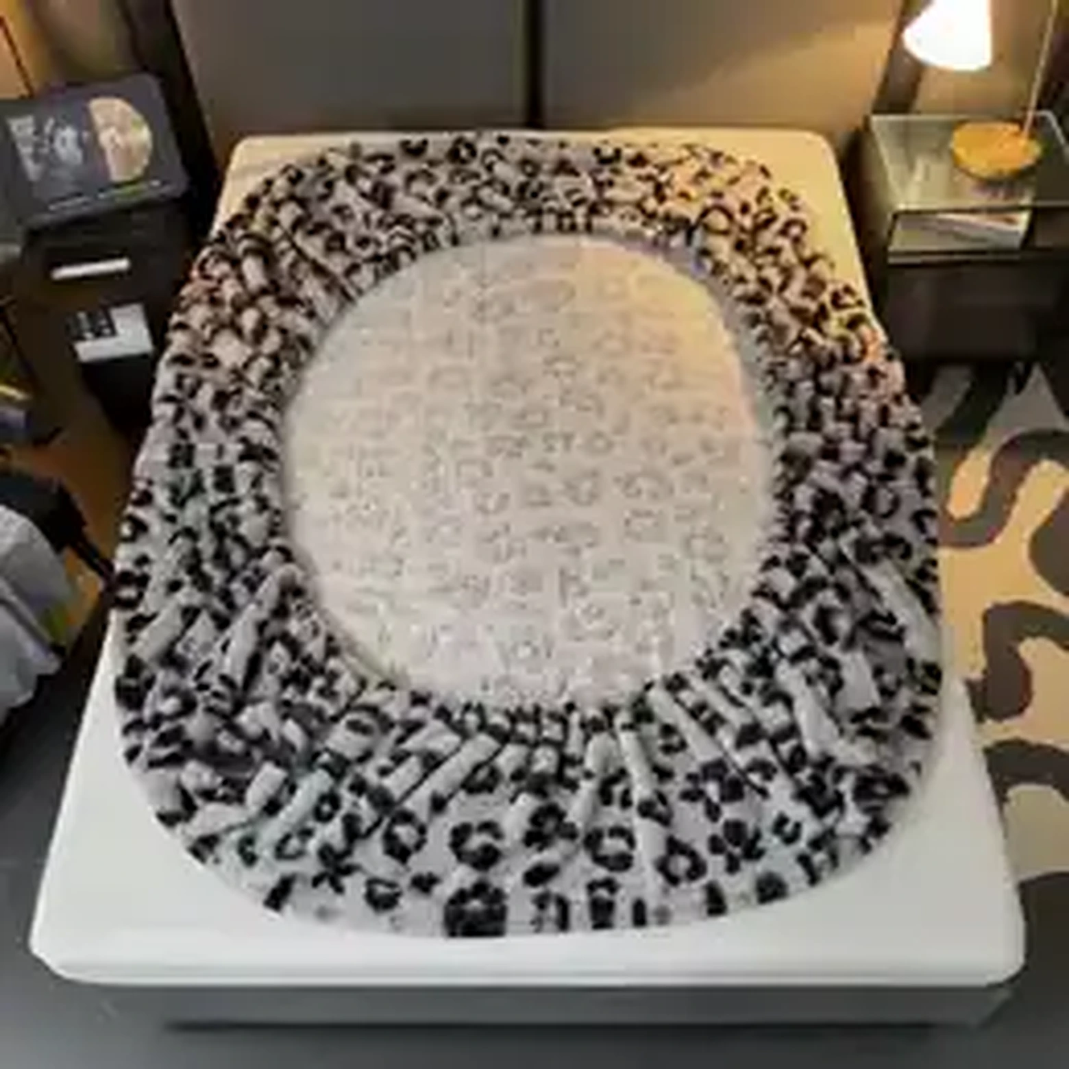 Leopard print warm mattress cover on a bed