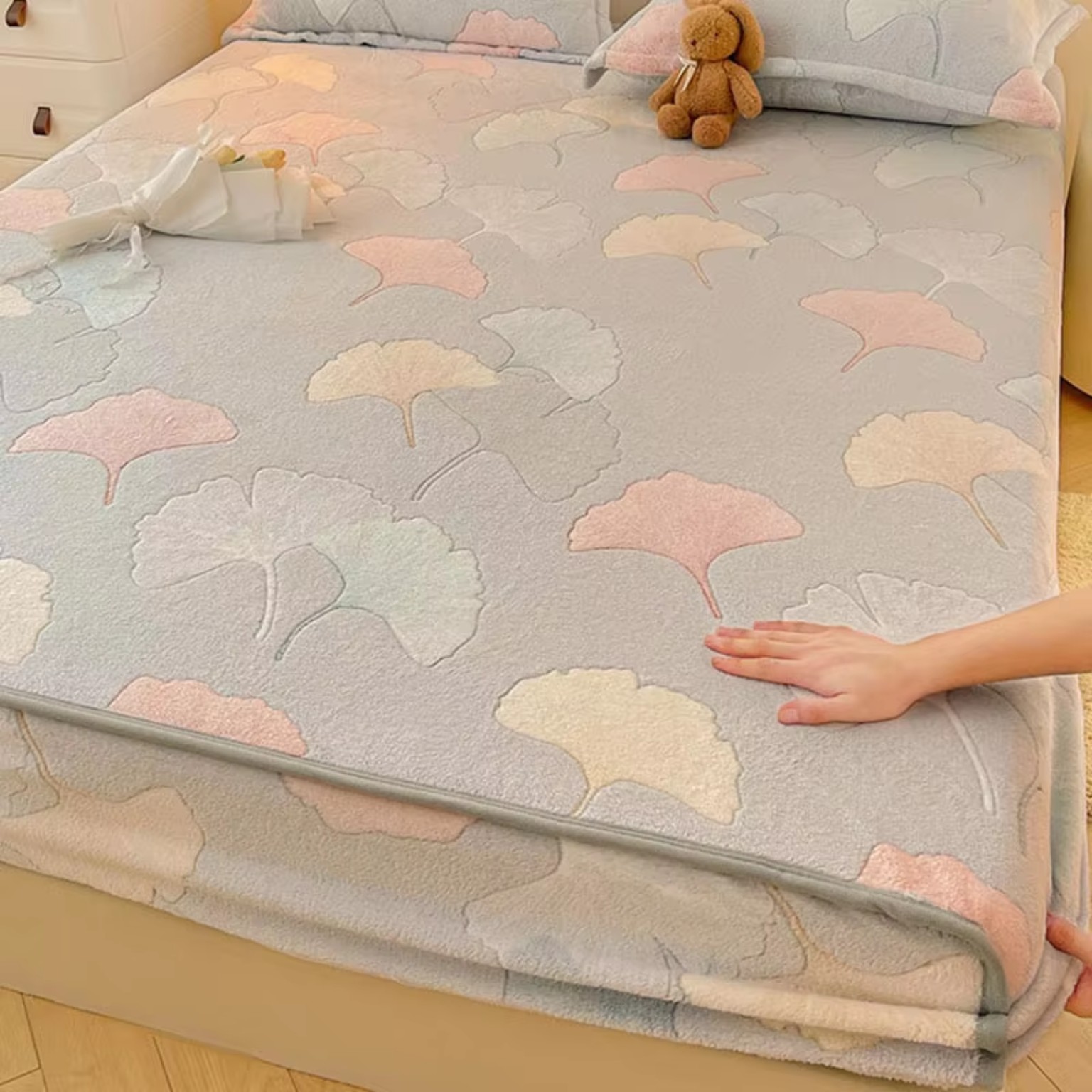 Pastel printed plush bedding on bed