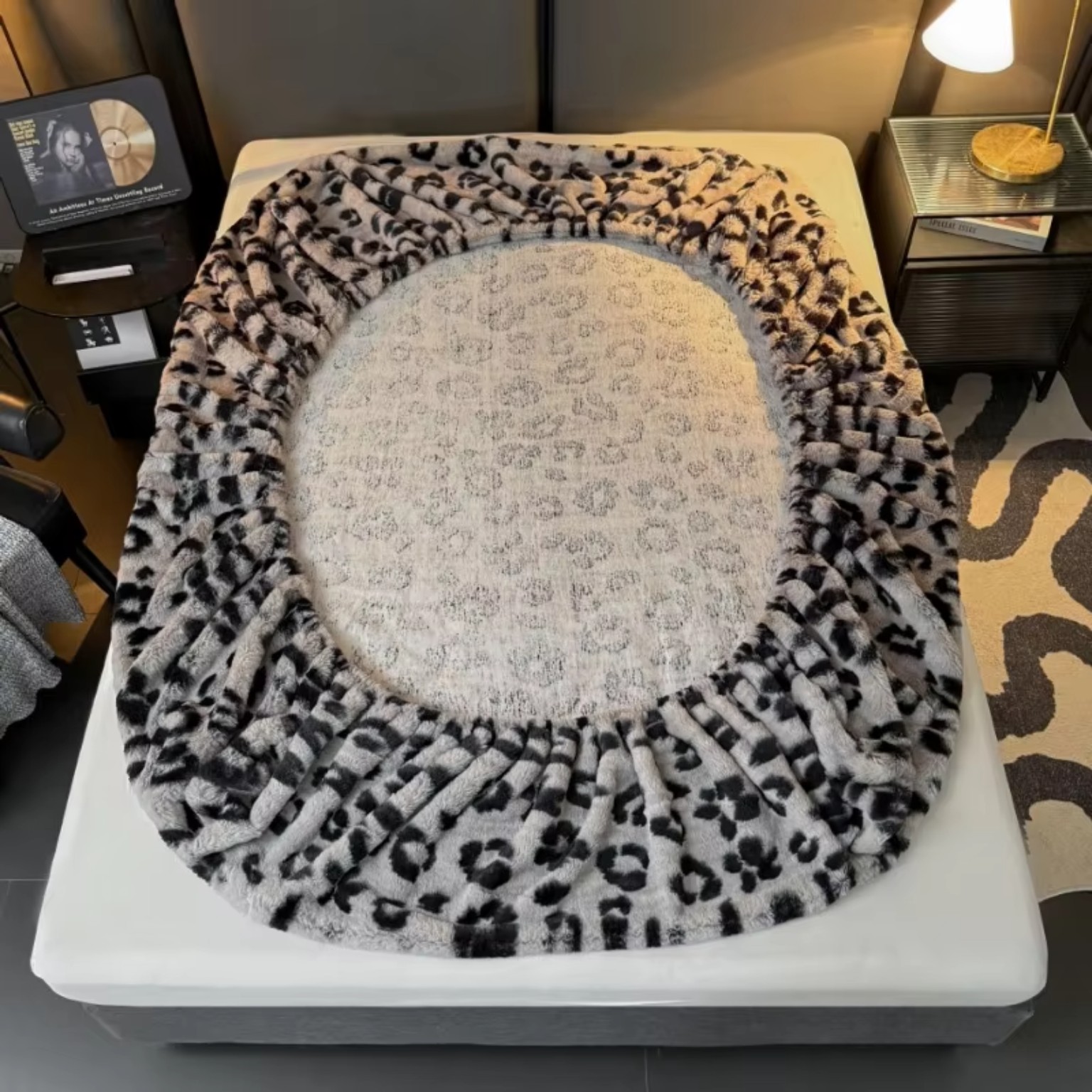 Leopard print warm mattress cover on a bed