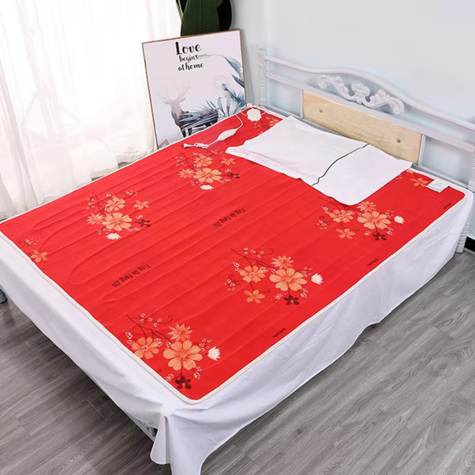 Electric heated blanket shown covering a bed